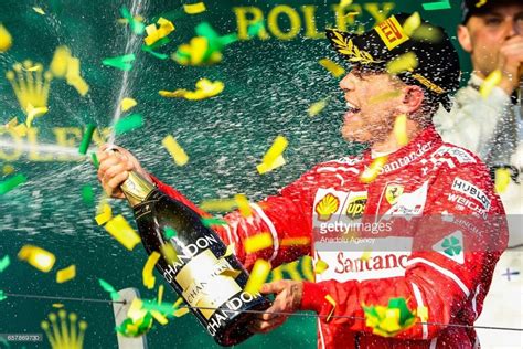 Sebastian Vettel Ferrari and the Rolex grid girls on the podium at 